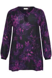 Plussize blomstret tunika i nuancer af lilla og sort, med V-hals og lange ærmer, designet til stilfulde hverdagsoutfits.