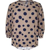 Let og luftig bluse med prikker og elegante detaljer.